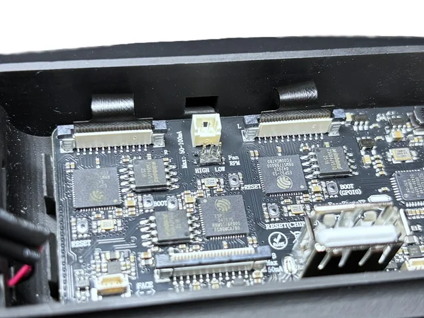 Black tabs lifted to open the ribbon cable connector