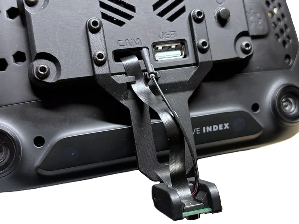 Face module arm installed at an angle to avoid cable tension