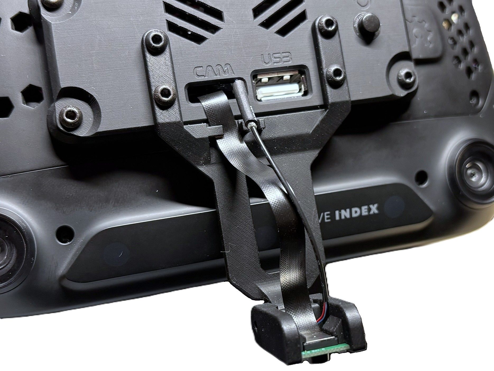 Face module arm installed at an angle to avoid cable tension