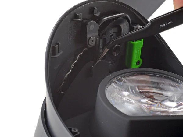Using tweezers to separate the left edge of the gasket