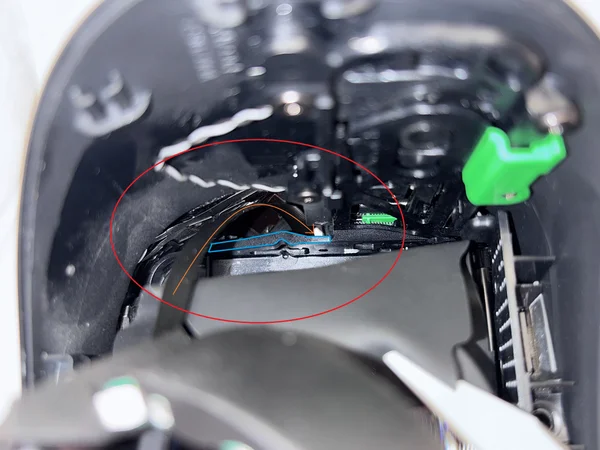 Using a light to illuminate the hole where the cable comes out